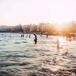 people at the beach during golden hour